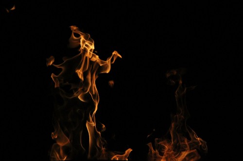 Image fire in black background with black background