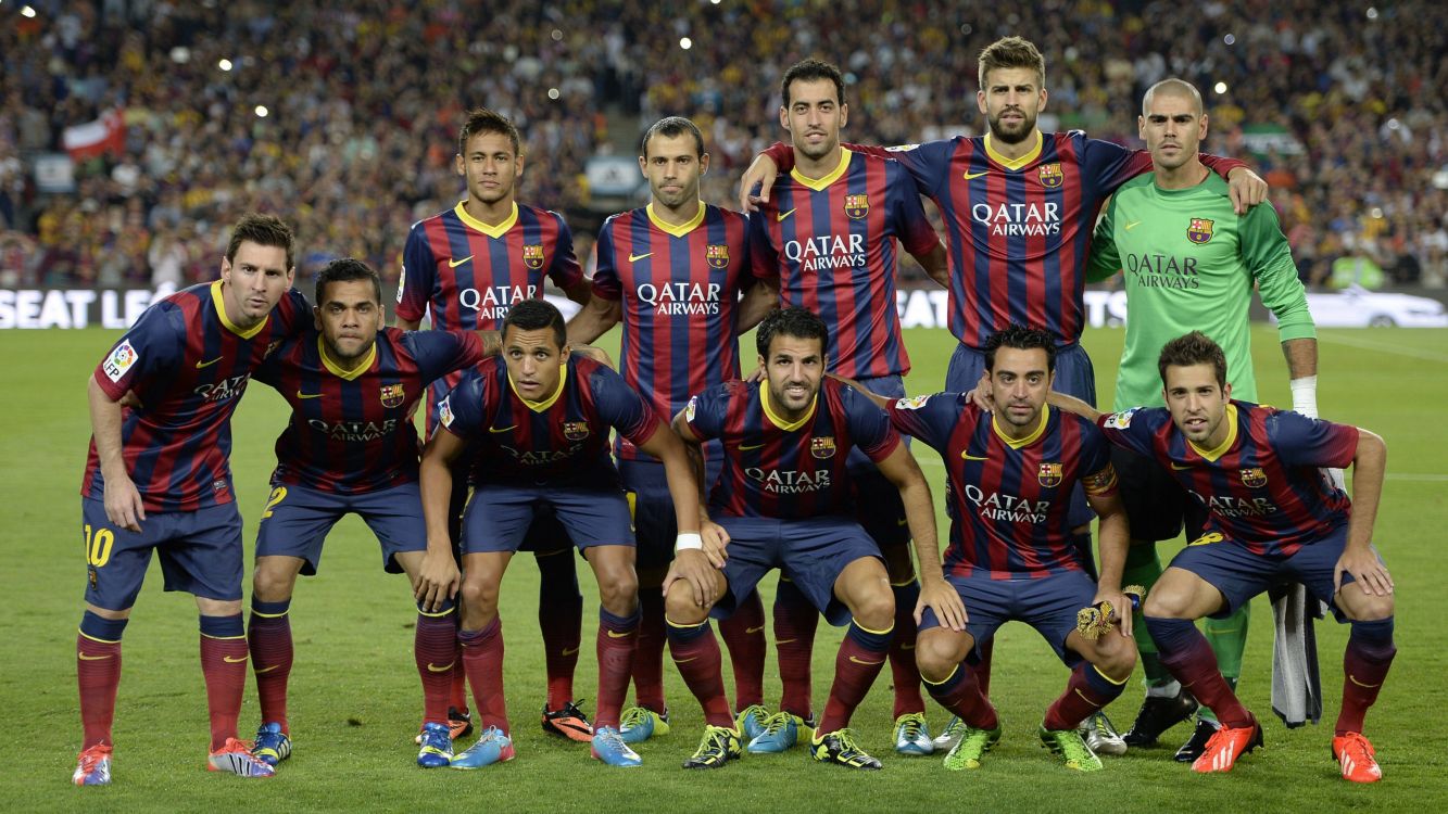 group of people in soccer jersey shirt on green grass field during daytime