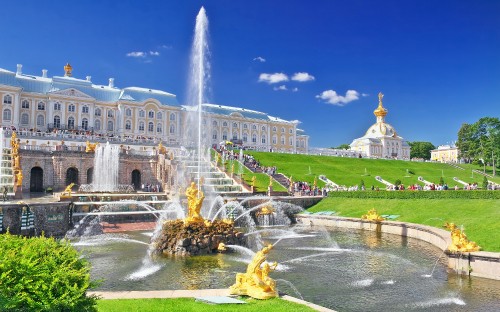 Image fountain in front of white building