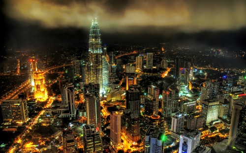 Image city with high rise buildings during night time