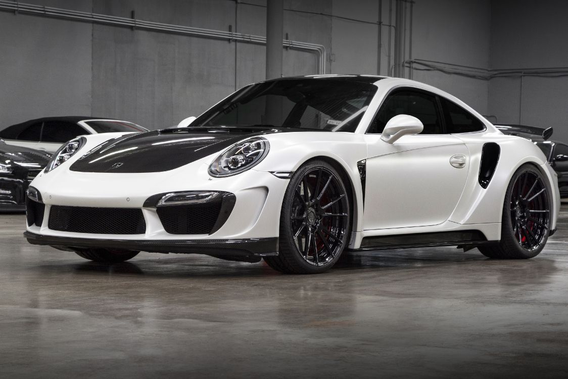 white porsche 911 parked in garage