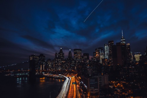 Image time lapse photography of city skyline during night time