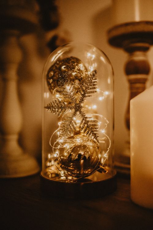 clear glass ball on brown wooden table