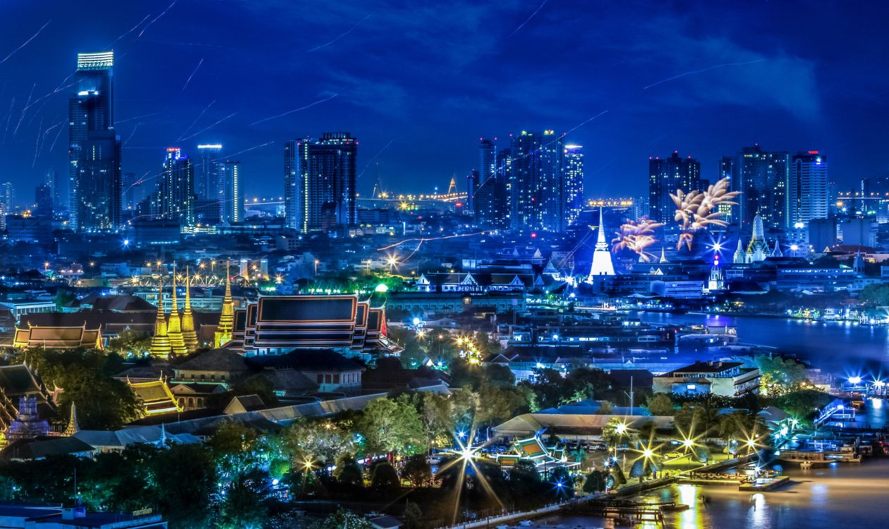 city with high rise buildings during night time