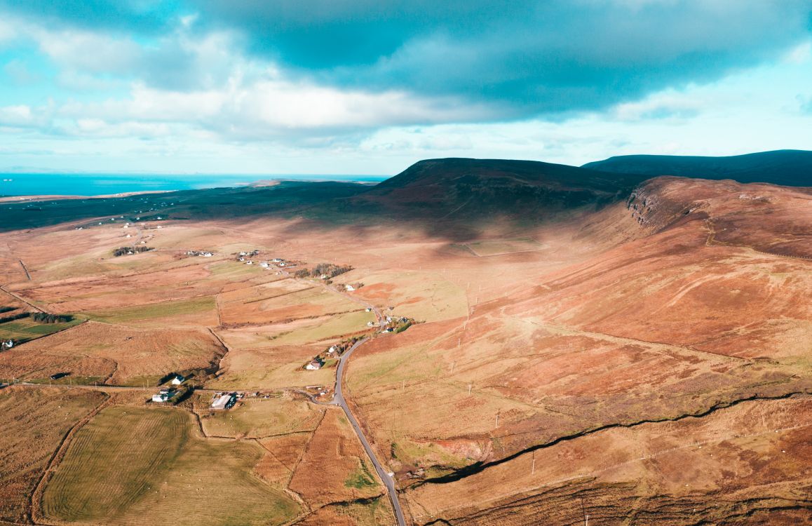 brown mountain under blue sky during daytime