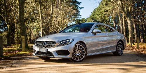 Image black mercedes benz coupe on road during daytime