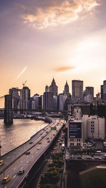 Image city skyline near body of water during daytime