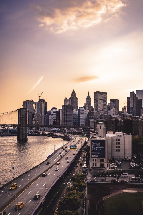 Image city skyline near body of water during daytime