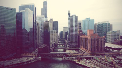 Image city buildings near body of water during daytime