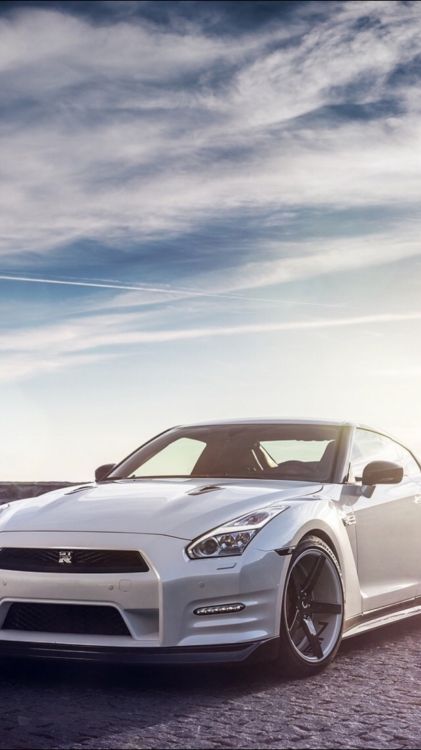 white porsche 911 on road under blue sky