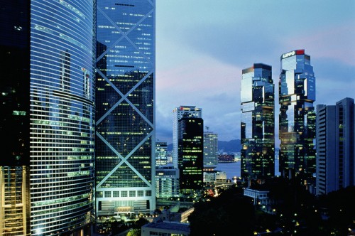 Image city buildings under gray sky during night time