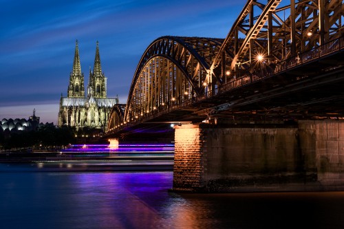 Image bridge over body of water during night time