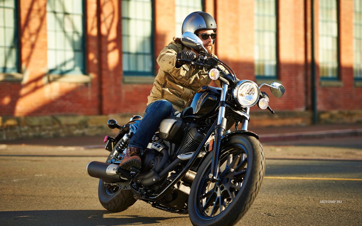 Man in Brown Jacket Riding Black Motorcycle. Wallpaper in 1920x1200 Resolution