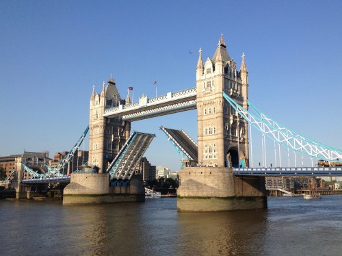 Image brown concrete bridge under blue sky during daytime