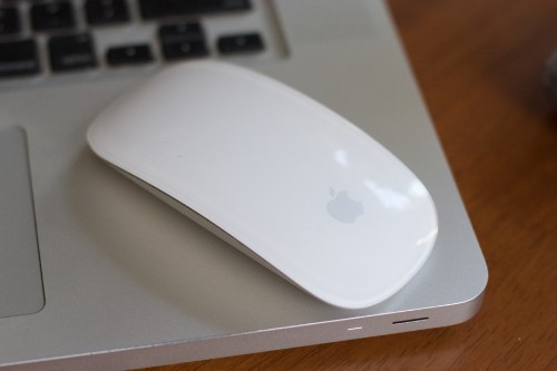 Image apple magic mouse on white table