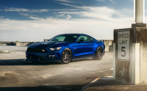 Image blue bmw m 3 coupe parked on gray concrete pavement under white clouds during daytime