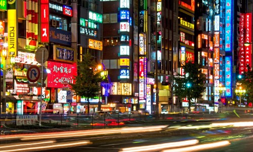 Image city buildings with lights turned on during night time