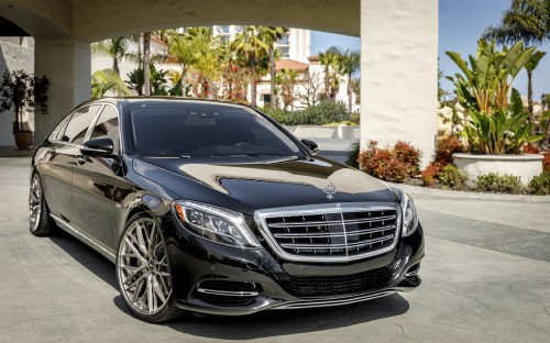 Image black mercedes benz c class parked near white concrete building during daytime