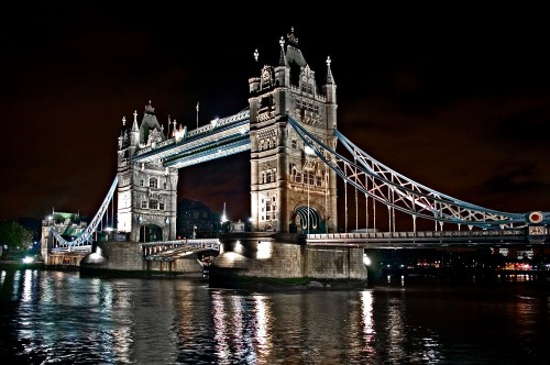 Image white bridge over river during night time