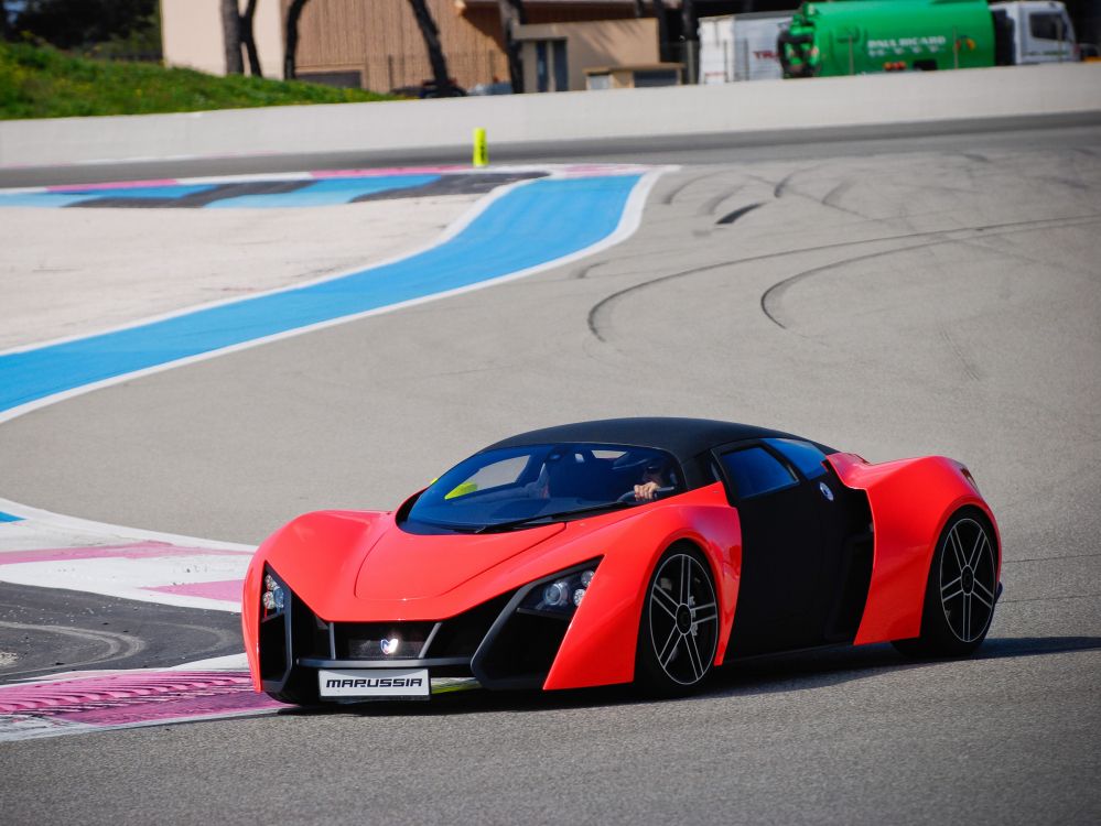 red ferrari 458 italia on track field