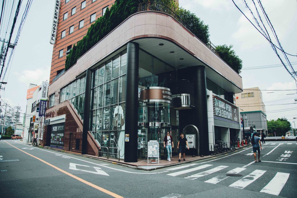 black and brown concrete building beside road during daytime