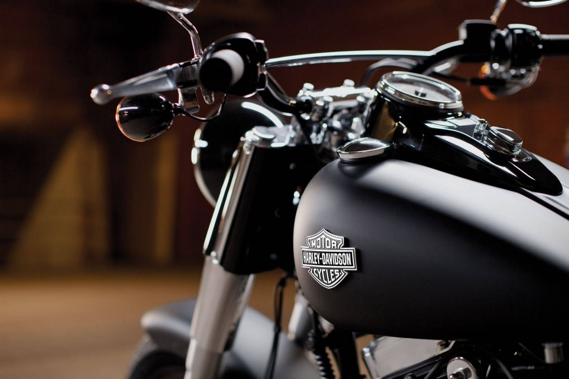 black and silver motorcycle on brown concrete floor