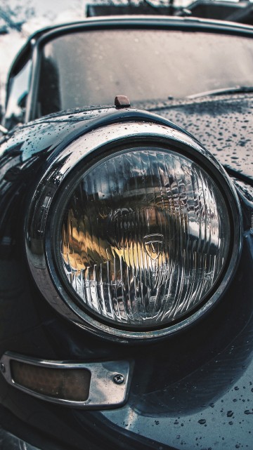 Image black car with headlight on road during daytime