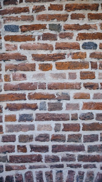 Image brown and black brick wall