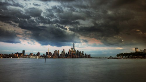 Image city skyline under cloudy sky during daytime