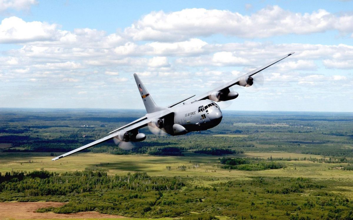 Black Airplane on Green Grass Field Under White Clouds and Blue Sky During Daytime. Wallpaper in 1920x1200 Resolution