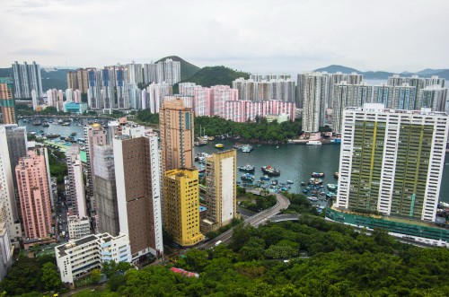 Image high rise buildings near body of water during daytime