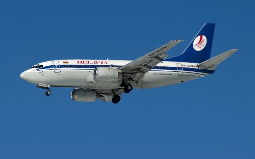 Image white and red passenger plane in flight