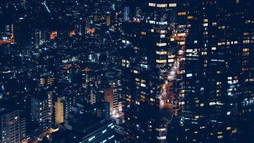 Image aerial view of city buildings during night time