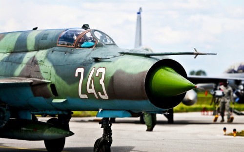 Image green and black fighter plane