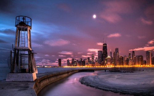 Image body of water near city buildings during night time