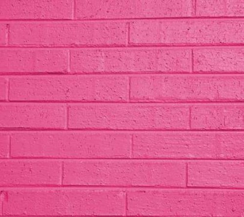 Image pink concrete wall during daytime