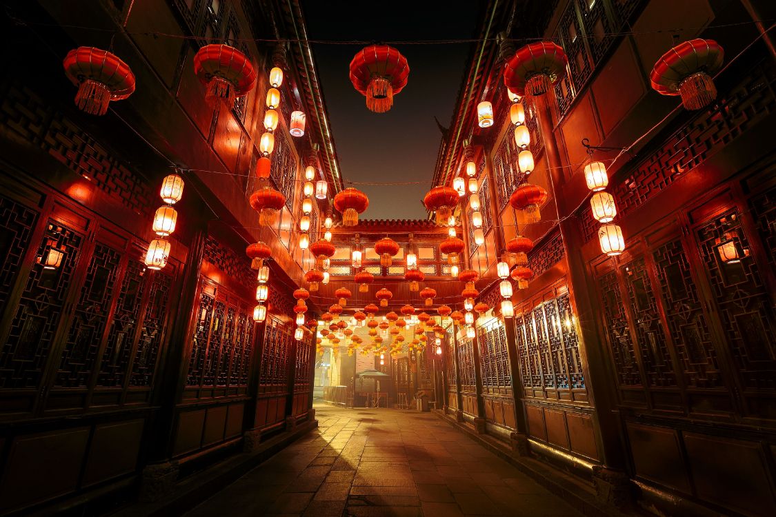 red and white pendant lamps turned on in building