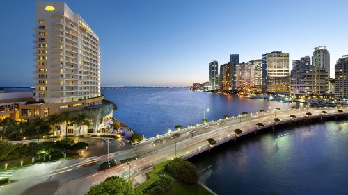 Image city skyline near body of water during daytime