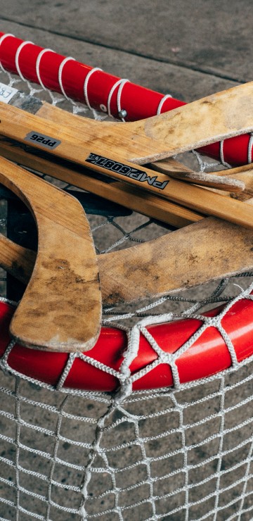 Image brown wooden boat paddle on net