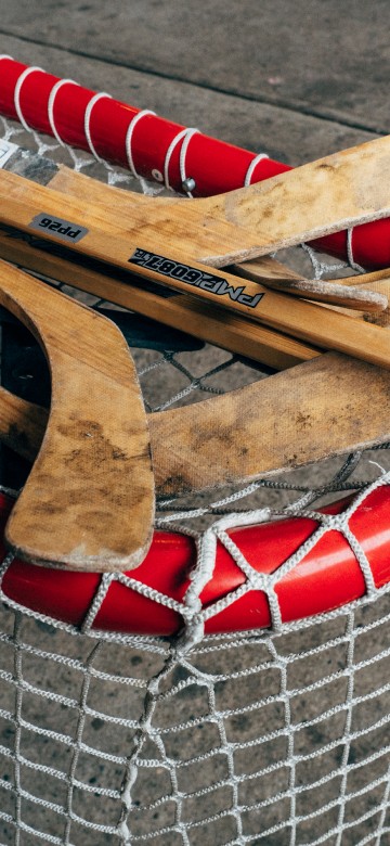 Image brown wooden boat paddle on net