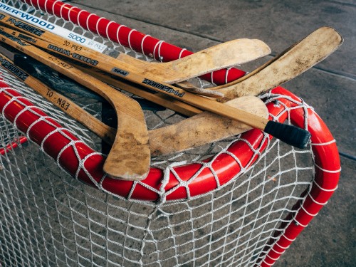 Image brown wooden boat paddle on net