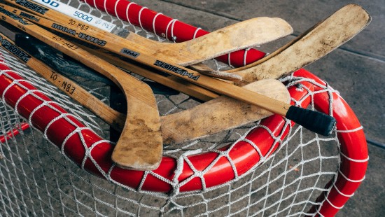 Image brown wooden boat paddle on net