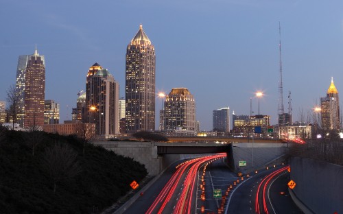 Image time lapse photography of city skyline during night time