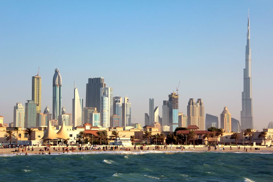 city skyline across body of water during daytime