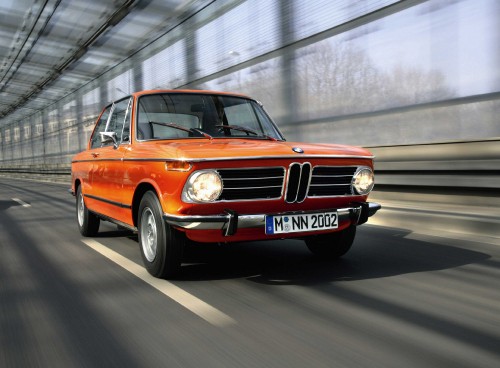 Image orange bmw m 3 on road