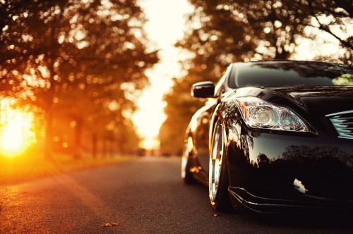 Image black porsche 911 on road during sunset