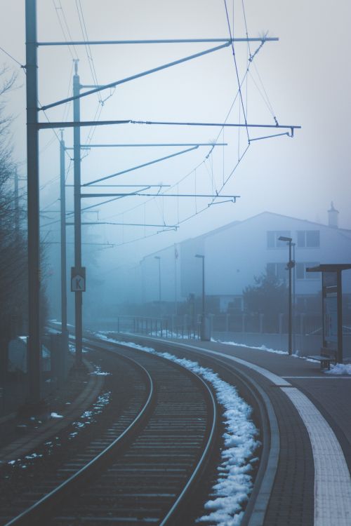 black metal train rail during daytime