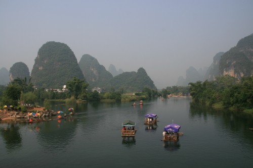 Image people riding boat on lake during daytime