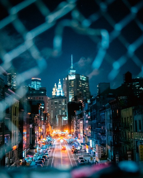 Image city with high rise buildings during night time