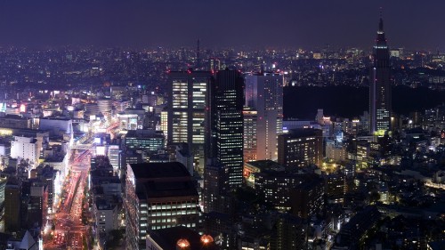 Image city with high rise buildings during night time